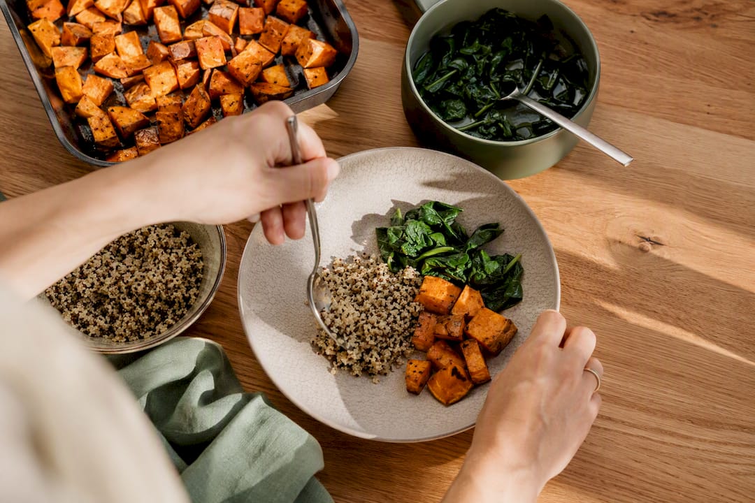 Hands plating personalized bone health meal